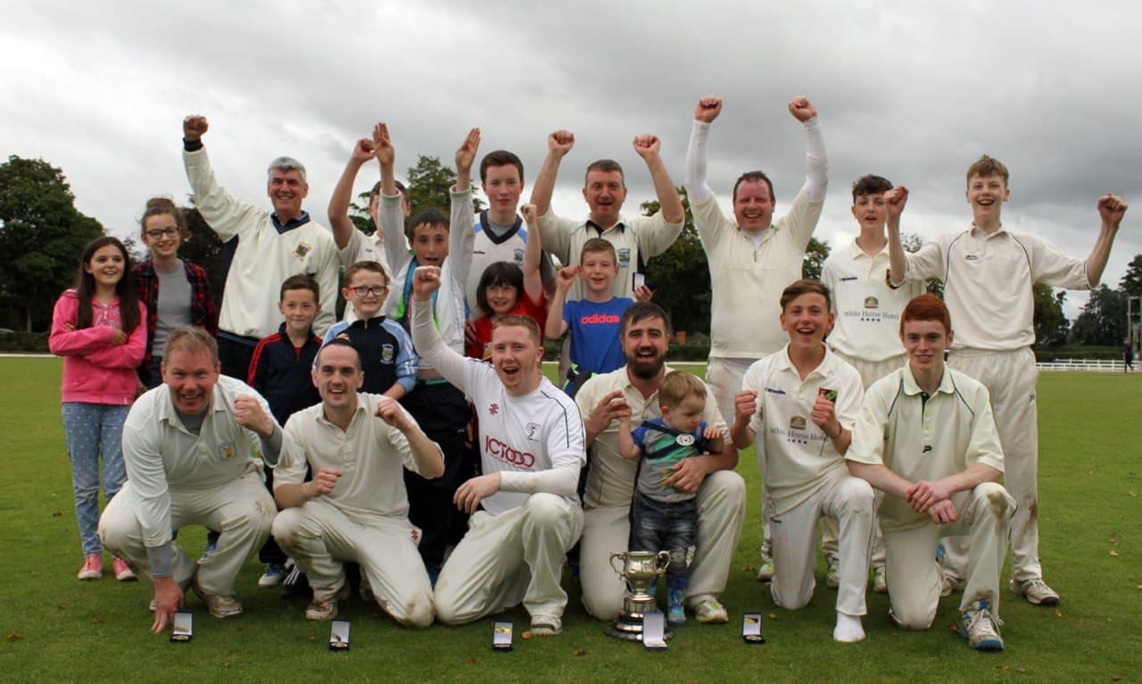 Trophy celebration with team and kids