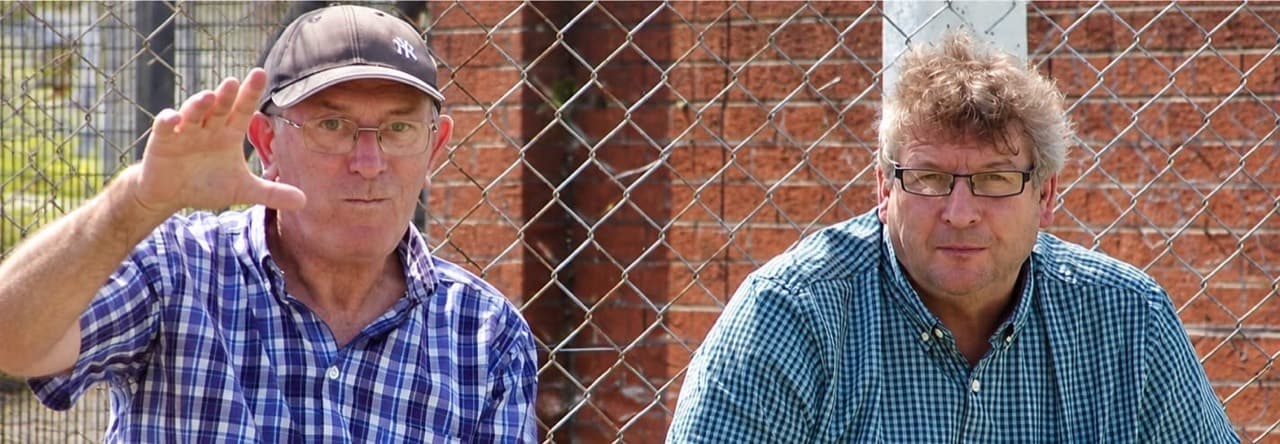 Two spectators at the cricket ground, from the photographs shared in memory of Reg Hargan