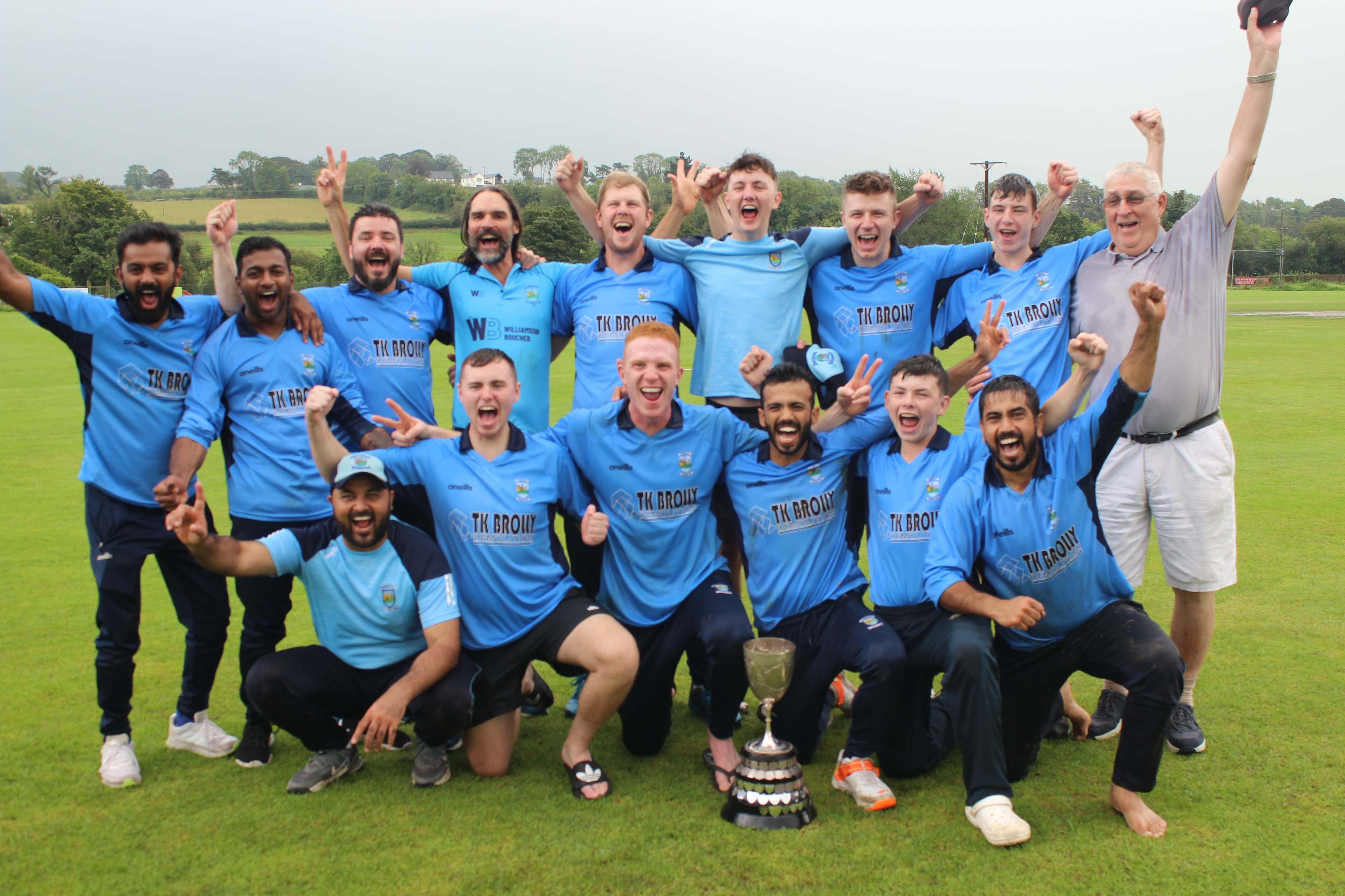 Team celebrating with trophy
